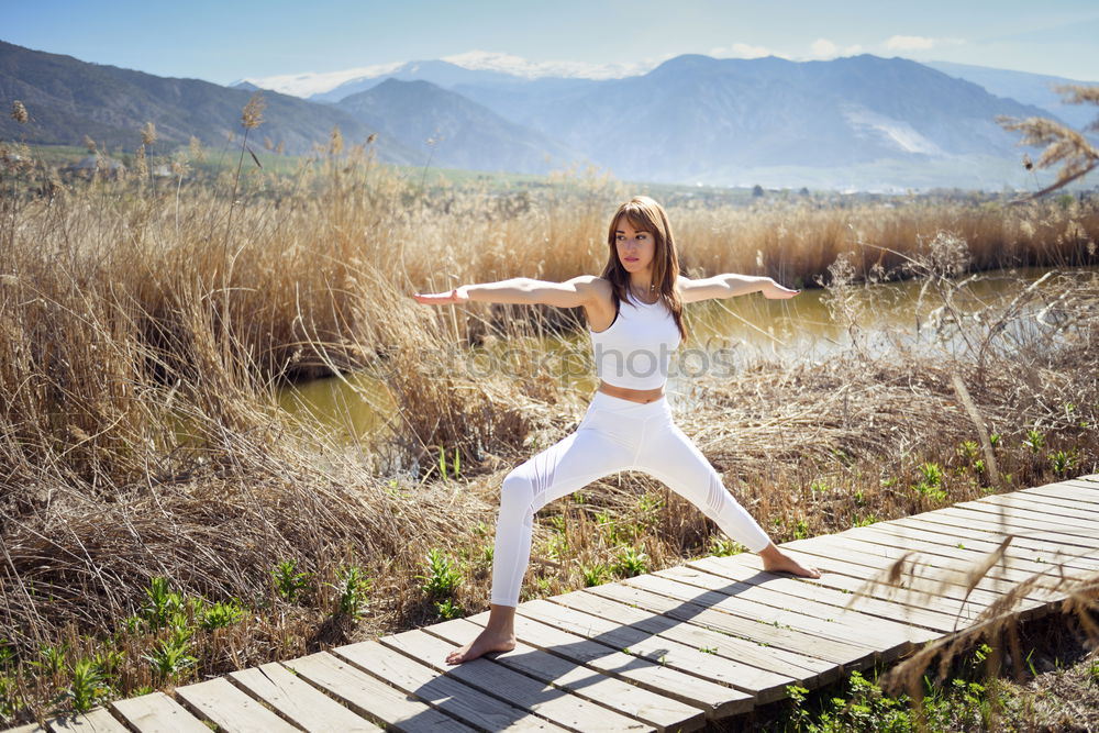 Similar – Young woman doing yoga in Nature.