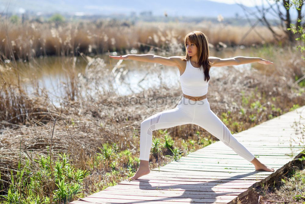 Young woman doing yoga in Nature.