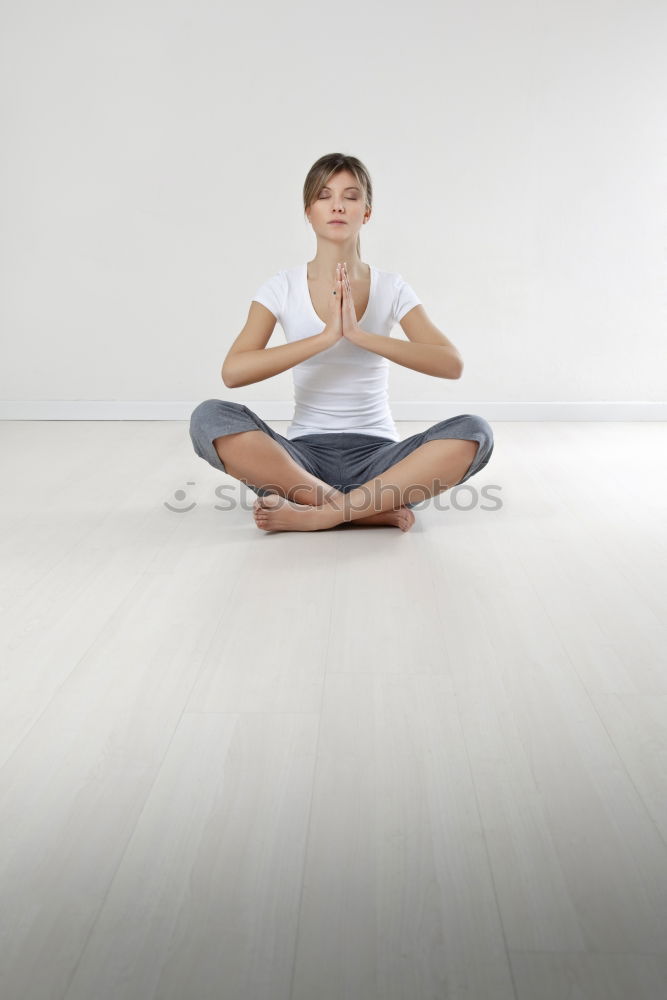 Similar – Anonymous man meditating during yoga training