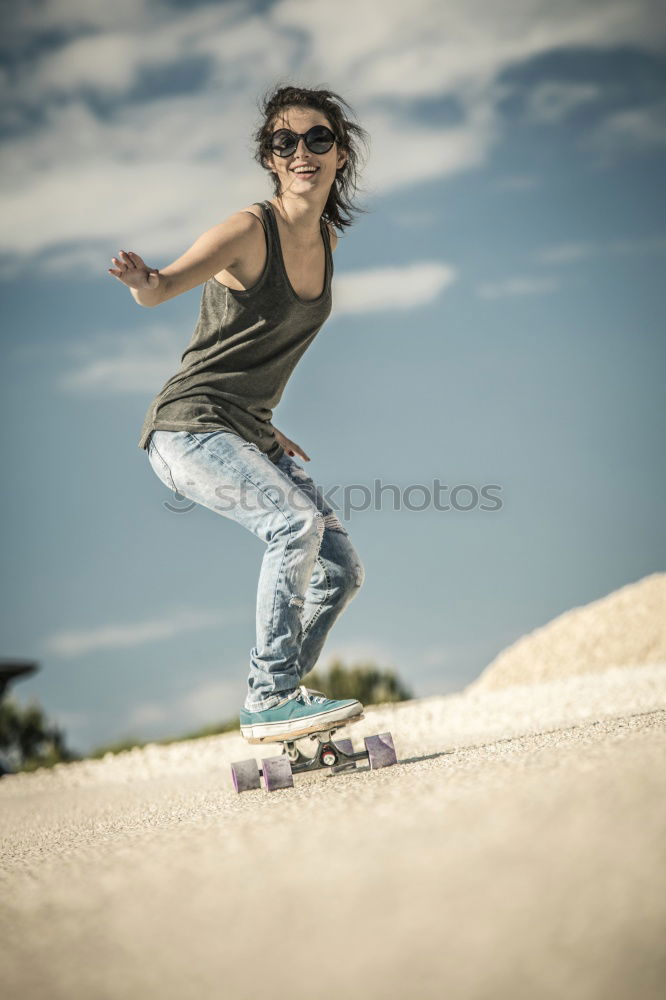 Similar – Image, Stock Photo Child wearing a helmet goes down a ramp with a scooter in a skate park on a sunny summer day