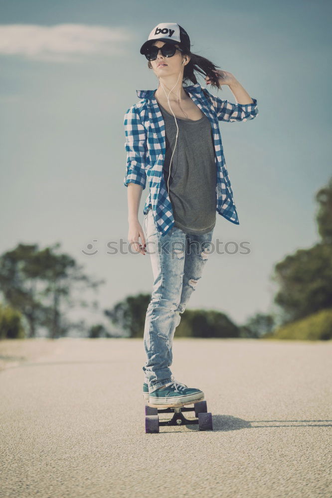 Similar – Kid skateboarder doing a skateboard trick.