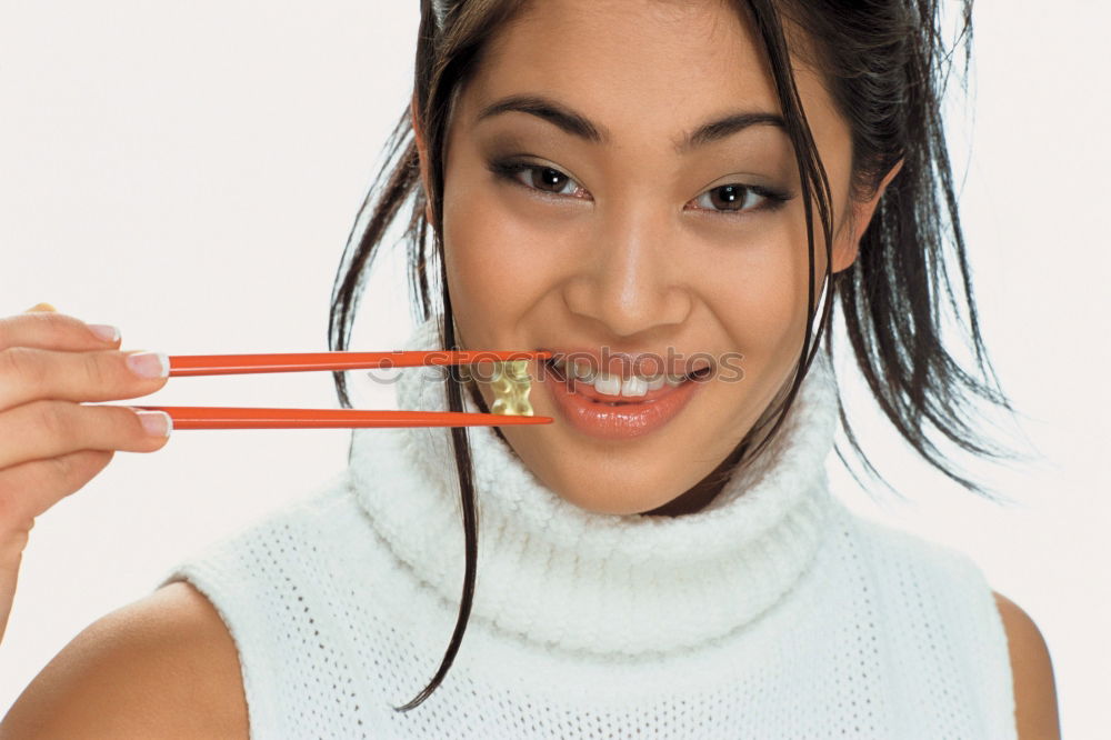 Similar – Crop woman eating sushi