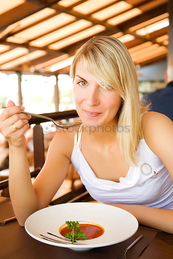 Similar – Content woman having meal