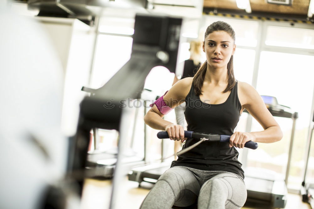 Similar – Woman resting after lifting barbell on muscular training