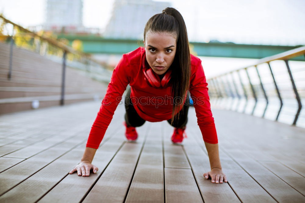 Similar – woman runner stretching outdoors