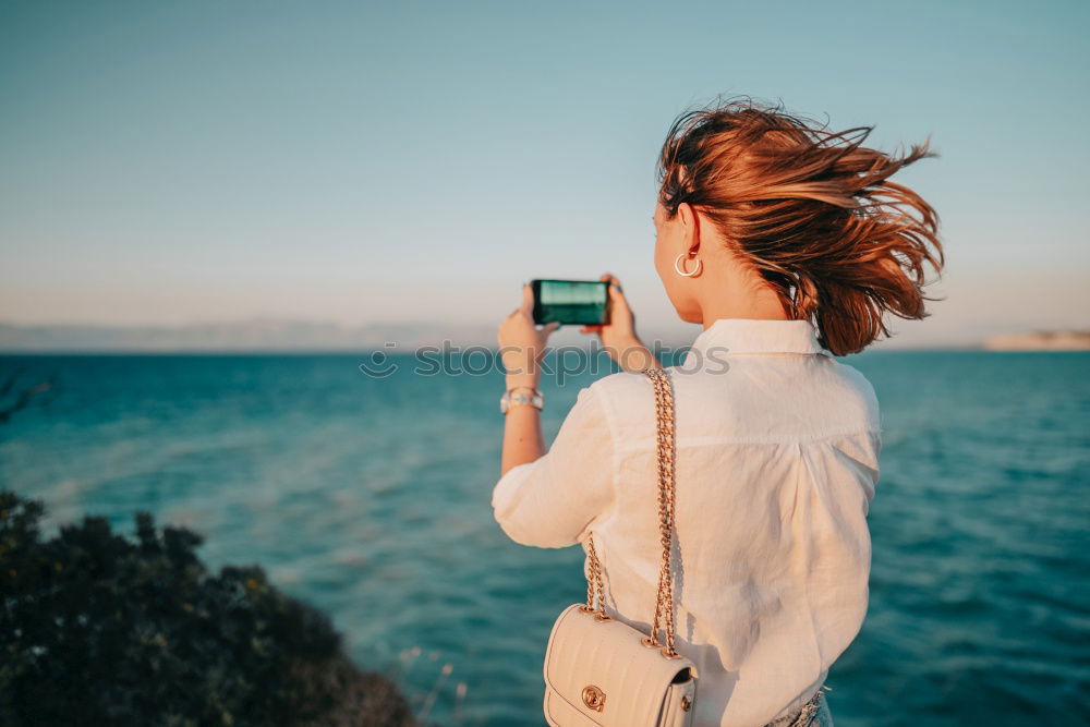 Similar – Blonde white woman holding an old VHS tape and playing with it.