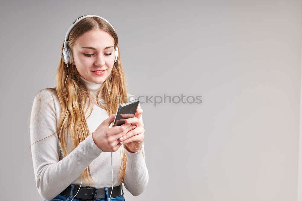 Similar – Image, Stock Photo Young woman with mobile phone walking a city street