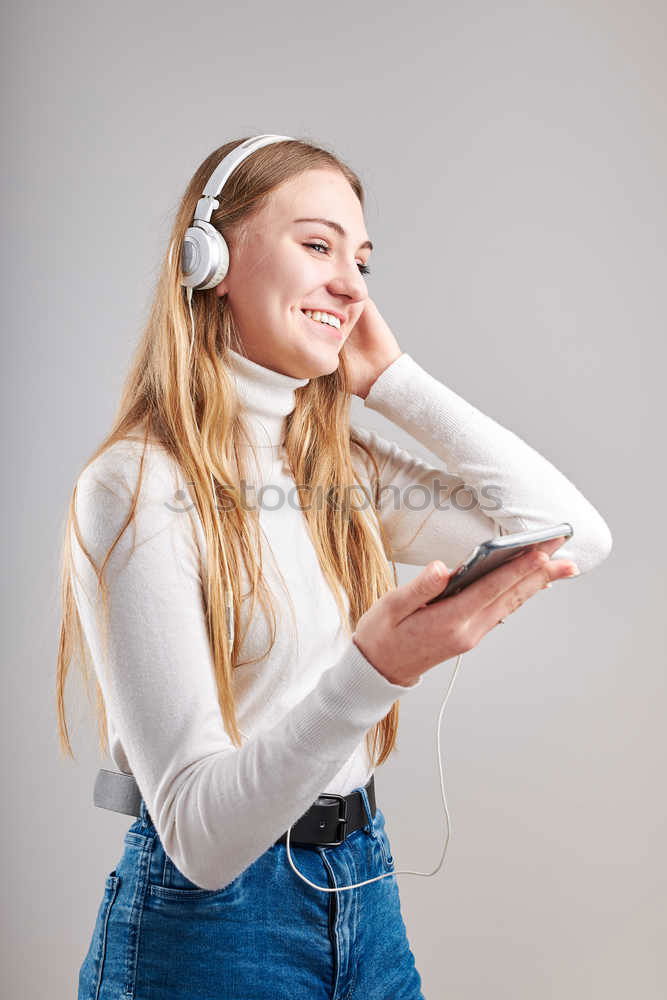 Similar – Image, Stock Photo Top shot of brother and sister listening to music together from smartphones