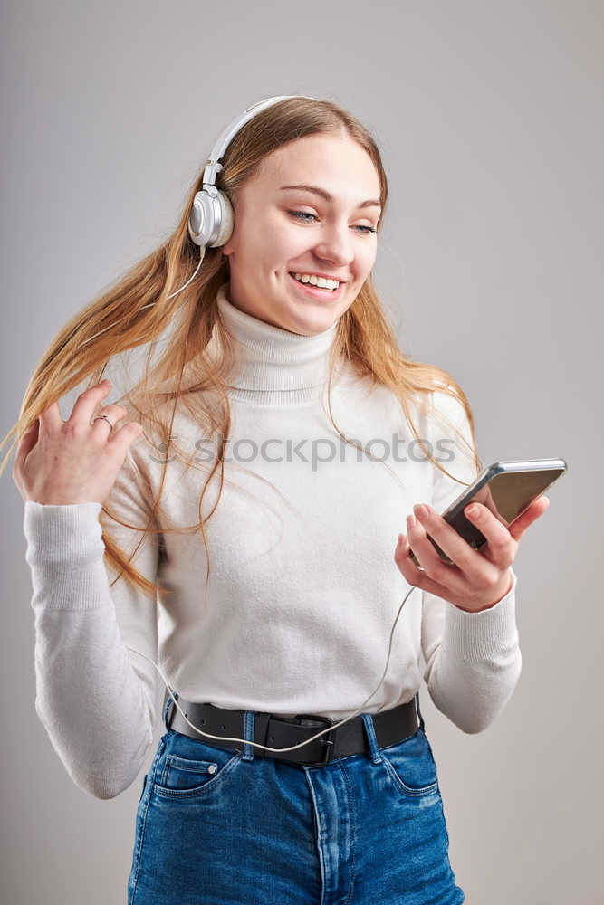 Similar – Image, Stock Photo young woman listening to music with wireless bluetooth headphones and mobile smart phone