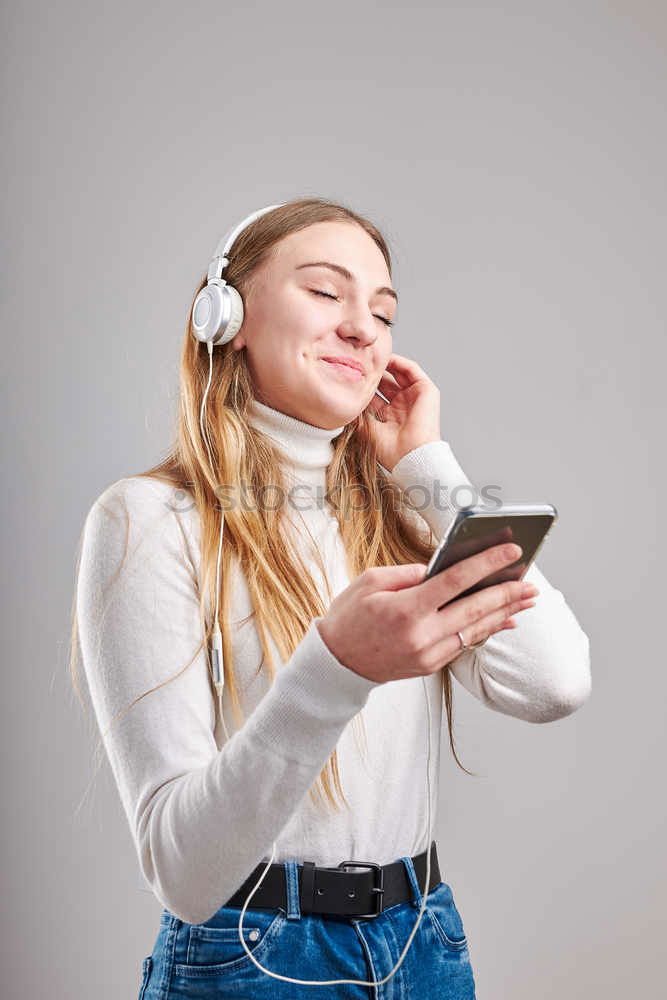 Similar – Image, Stock Photo young woman listening to music with wireless bluetooth headphones and mobile smart phone