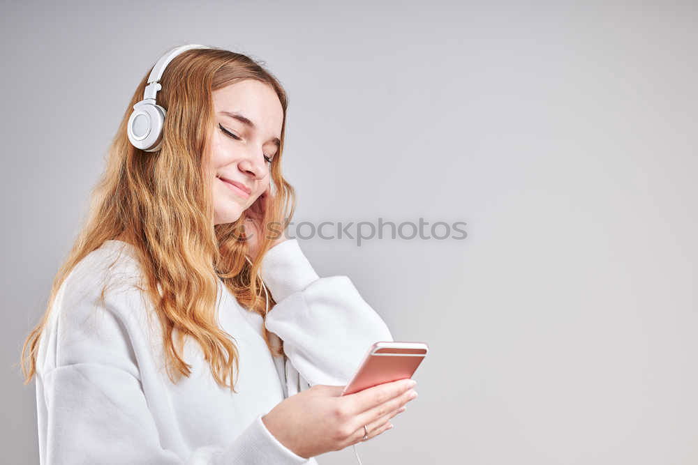 Similar – Image, Stock Photo Top shot of brother and sister listening to music together from smartphones