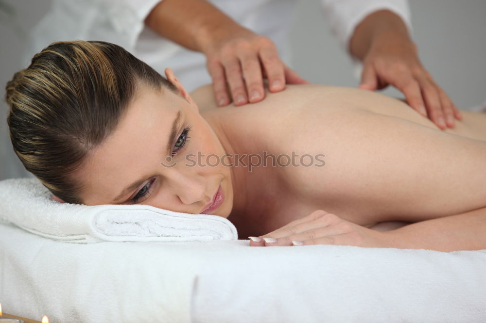 Similar – Image, Stock Photo Woman receiving back massage on clinical center