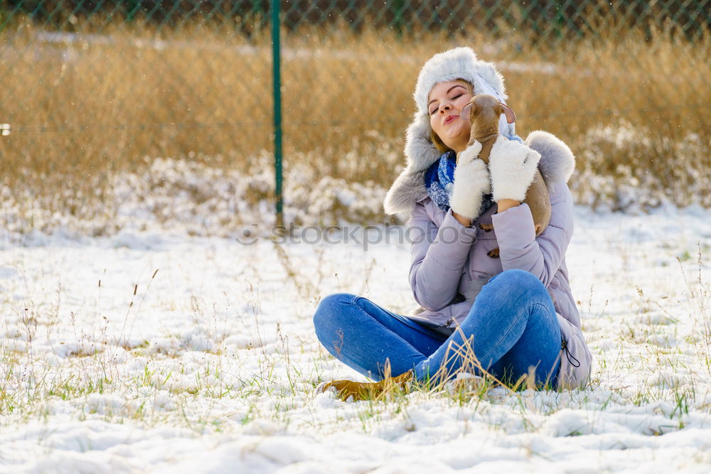 Similar – Image, Stock Photo Young cute woman lying playing and enjoying snow in winter