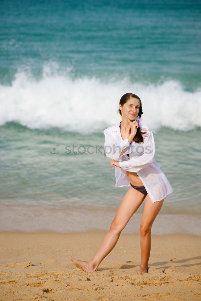 Similar – Süßes fröhliches kleines Mädchen, das im Badeanzug am Strand mit Sand spielt, ein Herz zeichnet und schreibt. Wunderschöner Sommersonnenuntergang, Meer, Kokospalmen, malerische exotische Landschaft. Phuket, Thailand