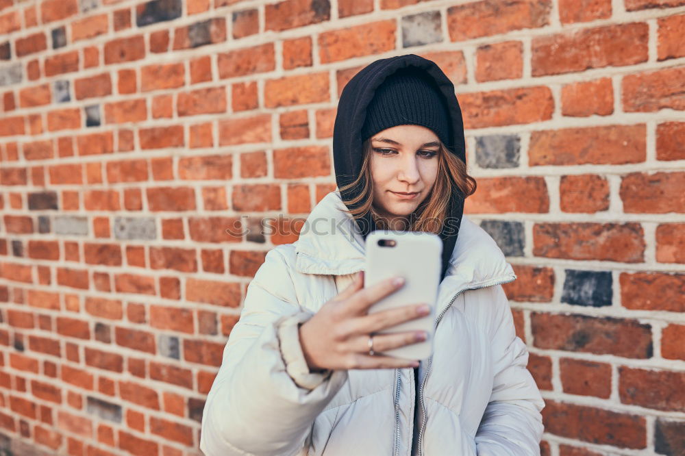 Similar – Image, Stock Photo Happy woman using smartphone at a wooden wall