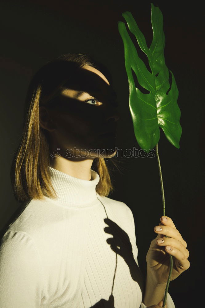 Similar – Artistic portrait of a young blond woman with flowers in studio