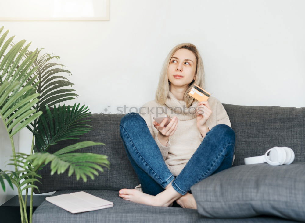 Similar – Image, Stock Photo young woman sitting on her diy couch with phone