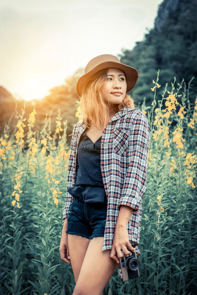 Similar – Woman in big round hat in middle of wheat field