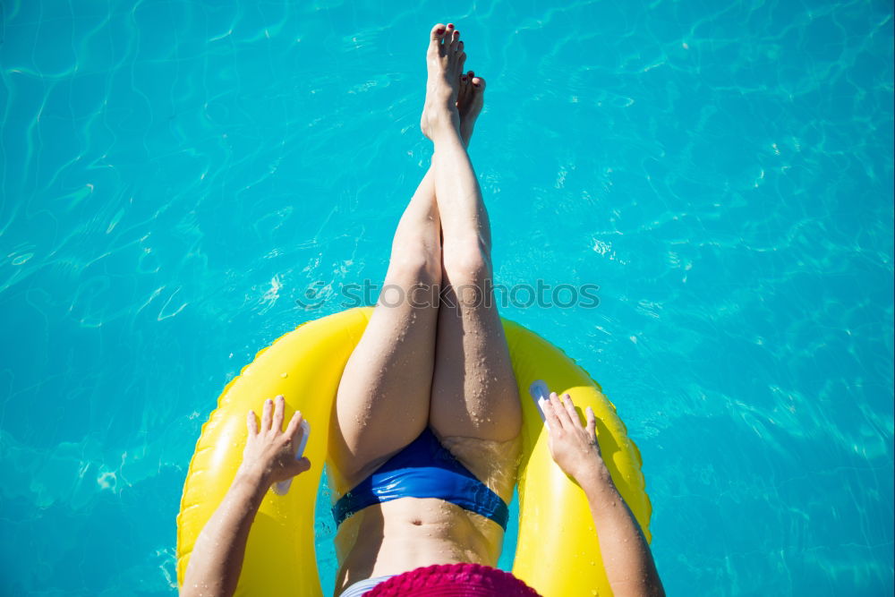 Similar – Image, Stock Photo Woman relaxing on inflatable ring in swimming pool