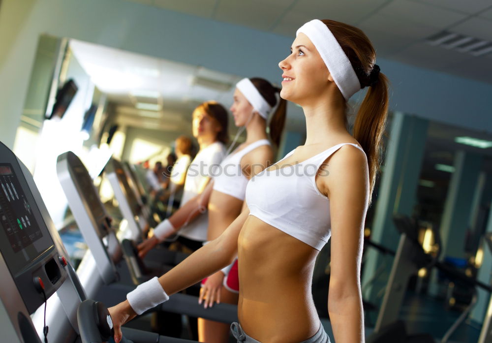 Similar – Woman training over treadmill on fitness center