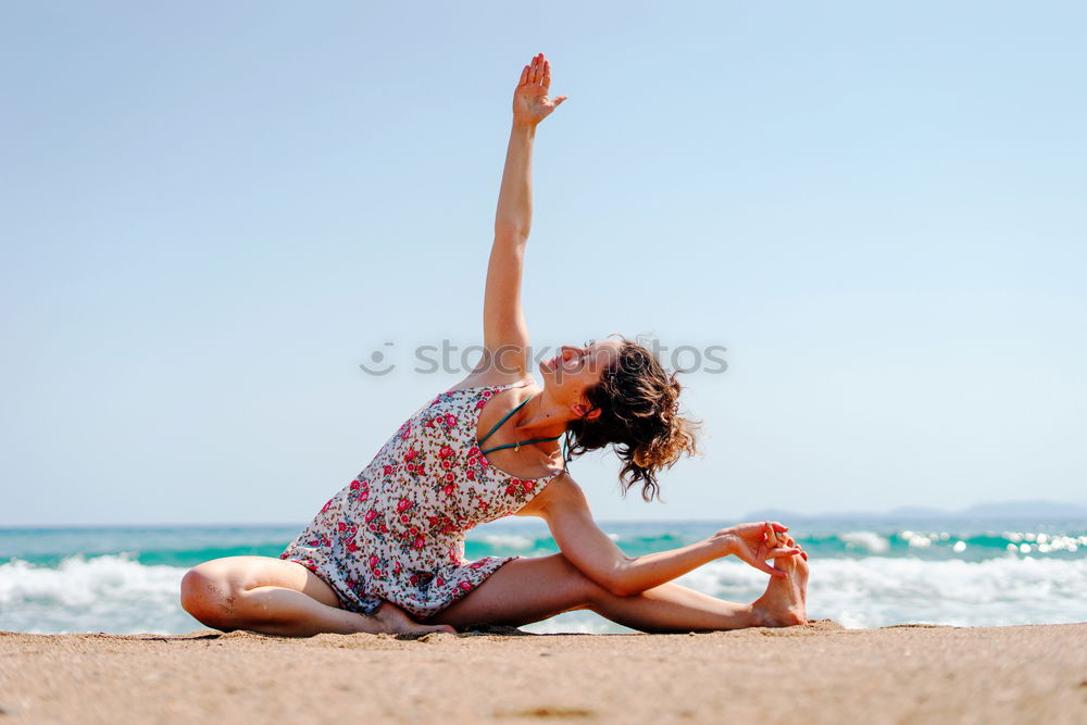 Similar – Rear view of young black woman doing yoga in the beach