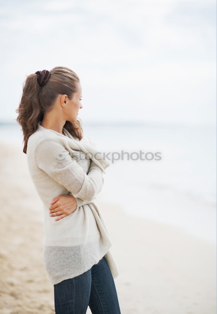 Similar – Brothers sitting at waterfront.Back view