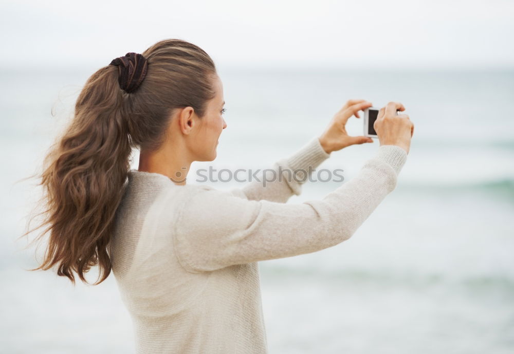 Similar – Image, Stock Photo Lady with camera on shore near stones and water