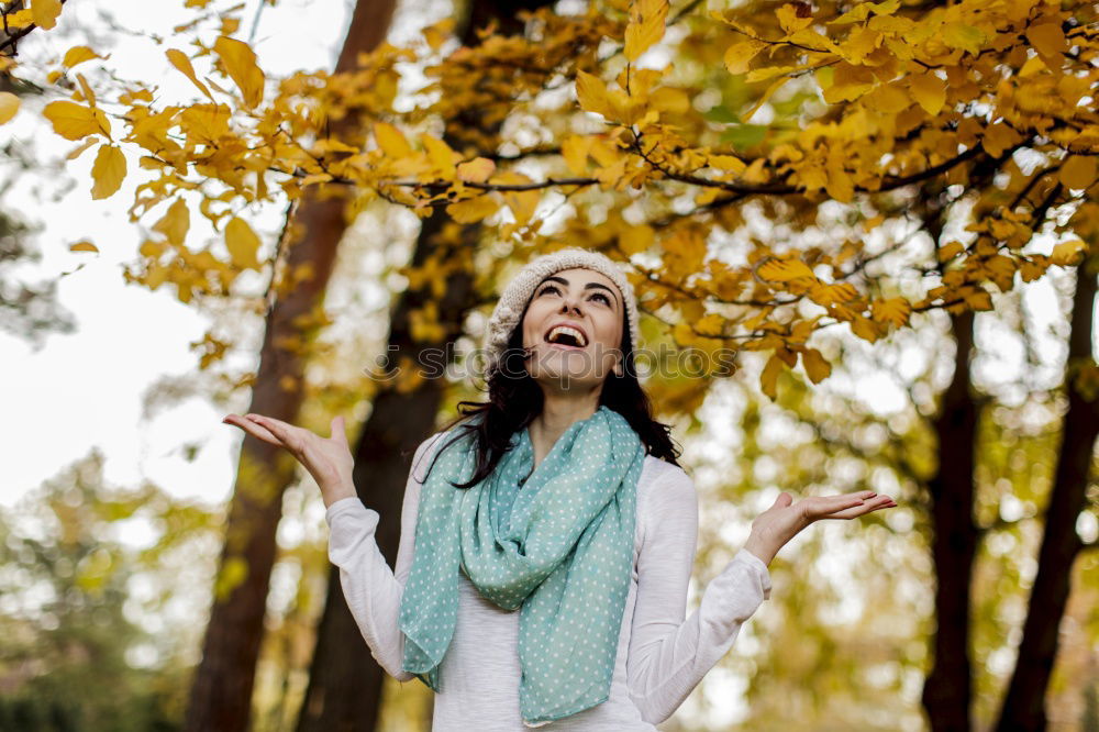 Similar – Image, Stock Photo Joyful young woman throwing autumn leaves