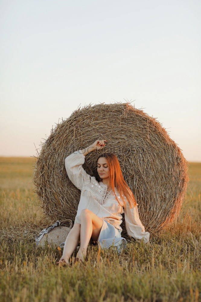 Similar – Image, Stock Photo Young woman hugging herself alone in nature