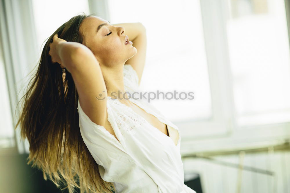 Similar – Image, Stock Photo Young smiling blond woman leaning against wall