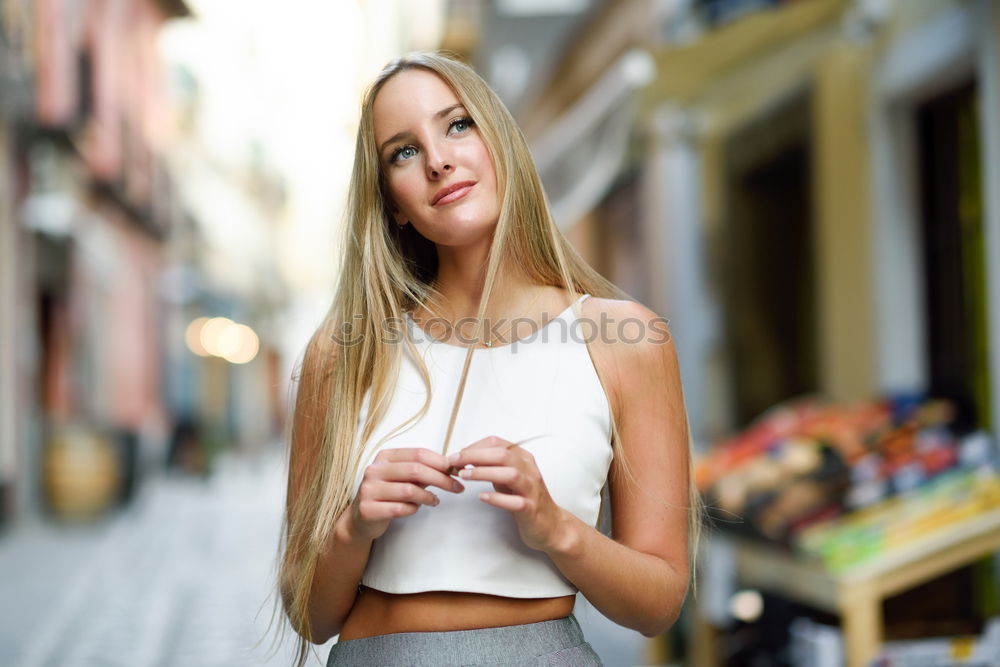 Similar – Smiling young woman in urban background.