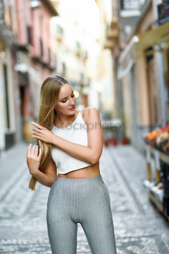 Similar – Smiling young woman in urban background.