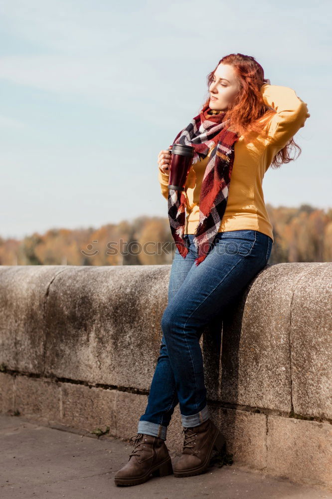 Similar – Woman in Winter Outfit in Front Old Gray Wall