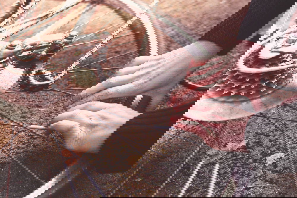 Young man fixing a bike