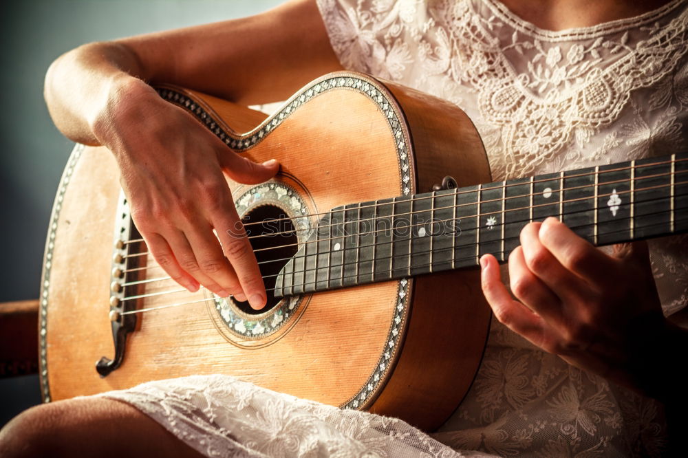 Similar – Beautiful woman playing guitar.