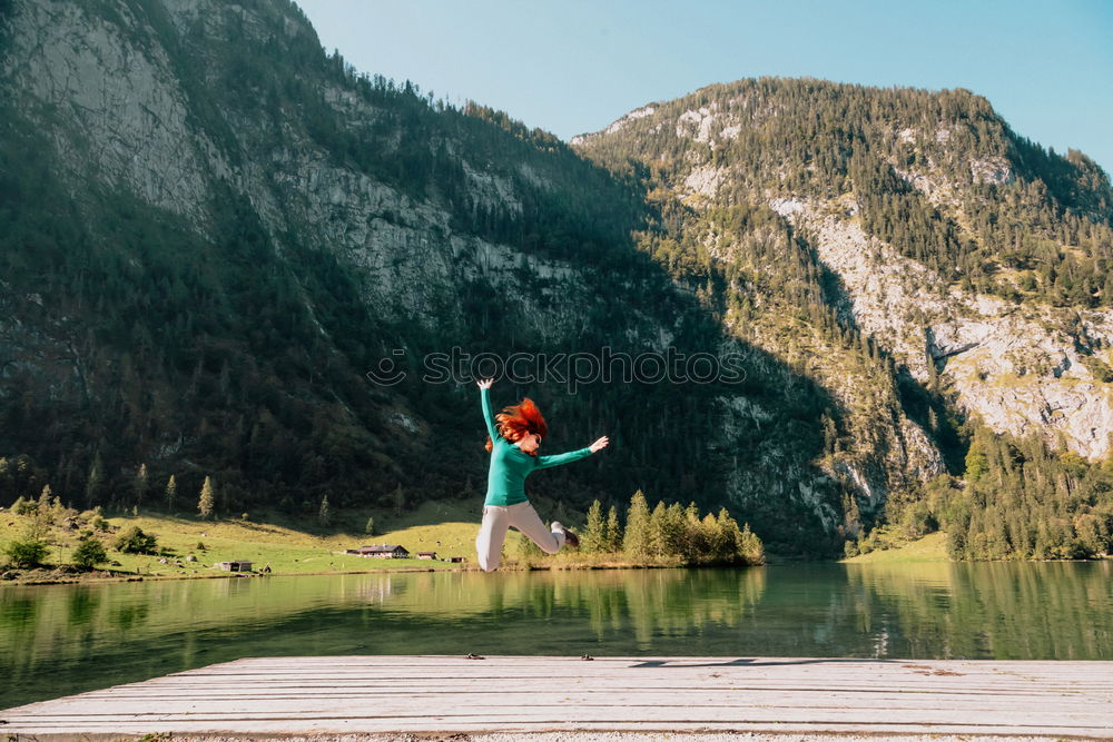 Similar – Image, Stock Photo Woman sitting on stone at lake