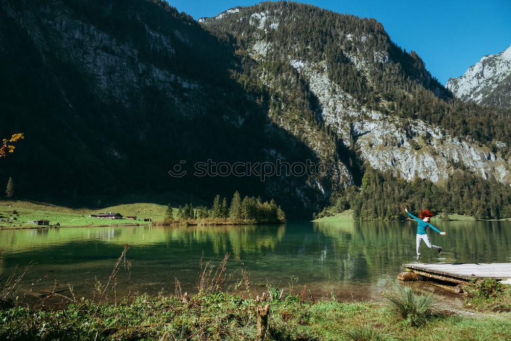 Similar – Women at lake in mountains