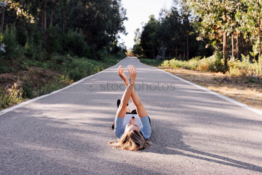 Similar – Image, Stock Photo Young caucasian woman doing yoga on road in sunset