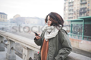 Similar – young woman against urban background eating ice cream