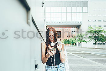 Similar – young woman with phone outdoors