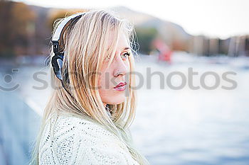 Similar – Image, Stock Photo Young girl with headphones standing on the street