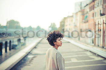 Similar – Image, Stock Photo Beautiful African girl with curly hair on the rooftop