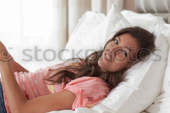 Similar – Image, Stock Photo Girl watching movie online on smartphone sitting on bed at home