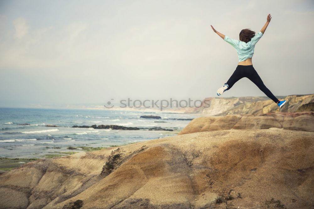 Similar – Image, Stock Photo Man jumping on cliff