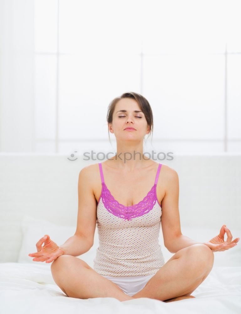 Teen girl doing yoga at home