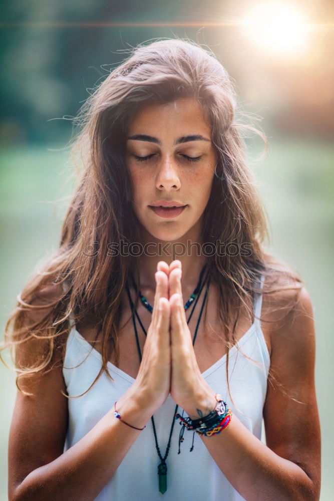 Beautiful young woman meditates in yoga asana Padmasana