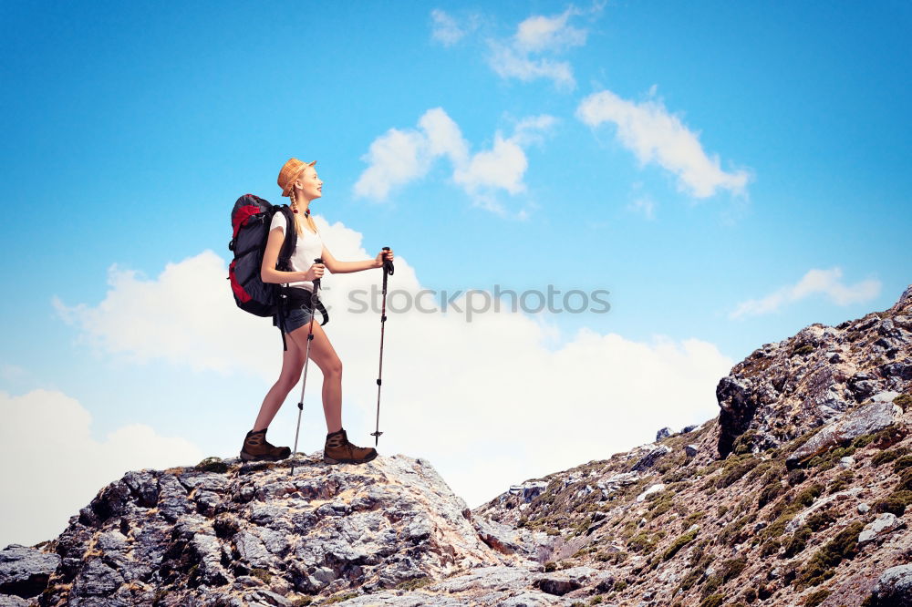 Similar – Woman walks on a mountain path in a sunny day.