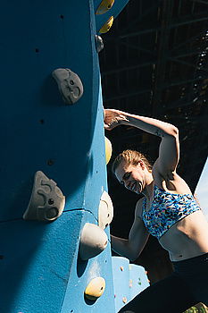 Similar – Woman with afro hair climbing by children’s attractions.