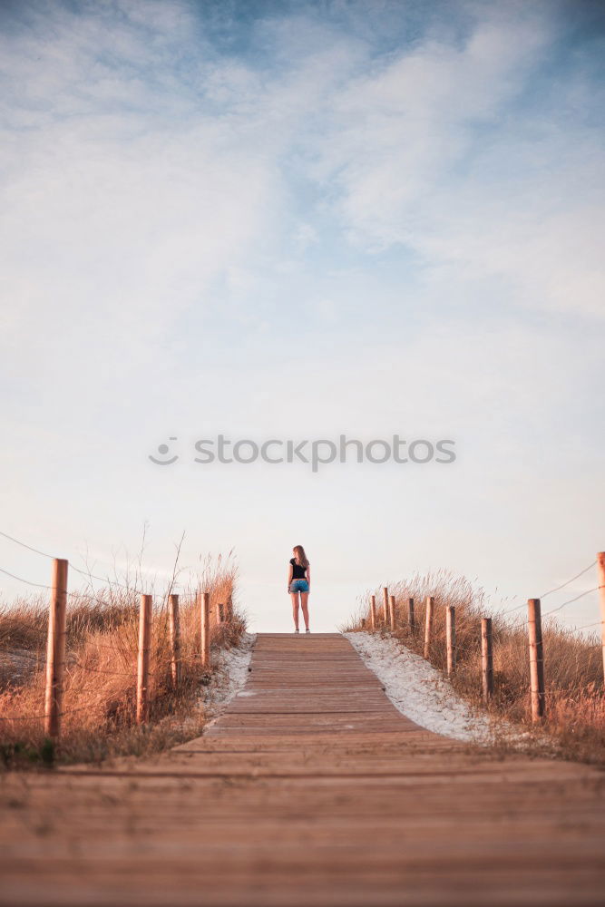 Similar – Image, Stock Photo Woman relaxing on a bridge in nature