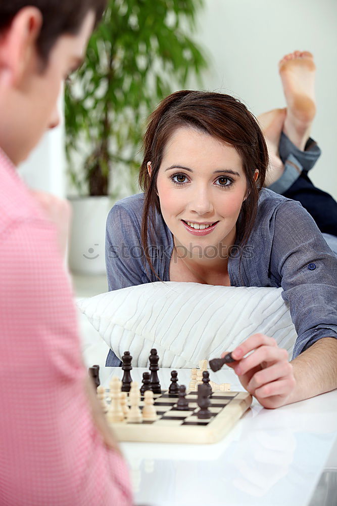 Similar – child girl playing checkers with dad